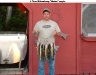 Happy fisherman with his catch.